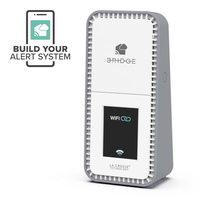 White and gray La Crosse Technolgy alert and montoring Bridge gateway facing left with text Build Your Own System