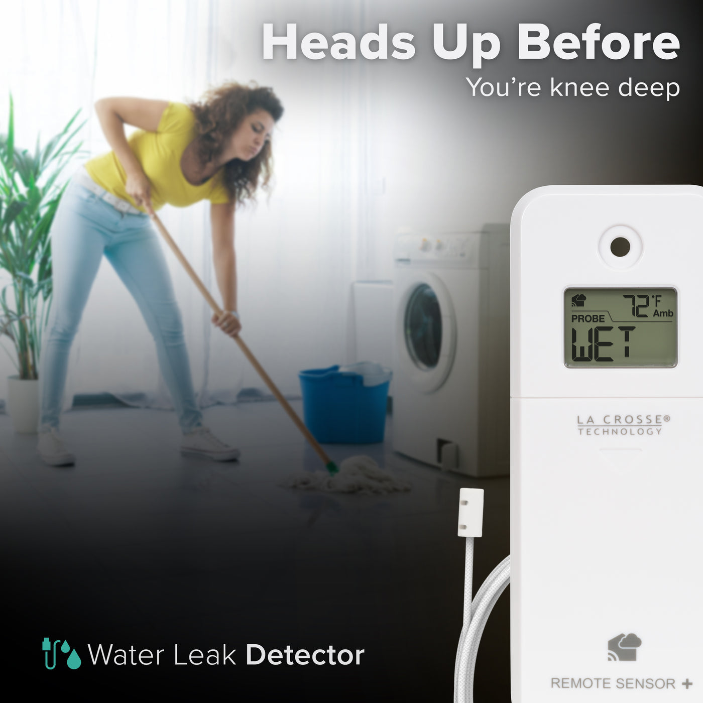 White alert and monitoring water leak area detection sensor with a braided cable in the foreground displaying an LCD screen reading wet and ambient temperature reading of 72 degrees Fahrenheit with a woman in a yellow t-shirt and jeans mopping up a floor in front of a front-load washing machine in the background