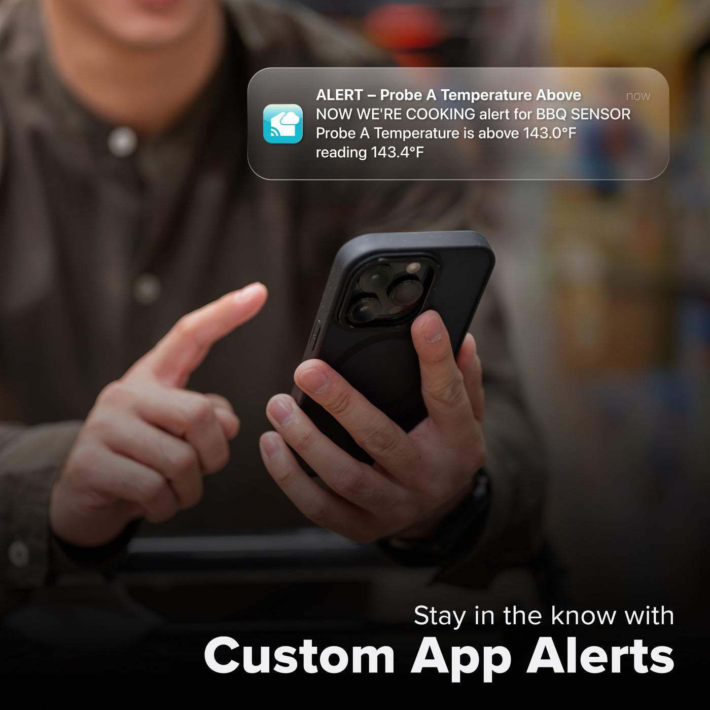 La Crosse Technology Alert and Monitoring system with a male  receiving a message on their smartphone of an alert that their meat thermometer barbeque sensor temperature has  gone above the parameters of a custom alert for the bbq sensor with text that says stay in the know with Custom Alerts
