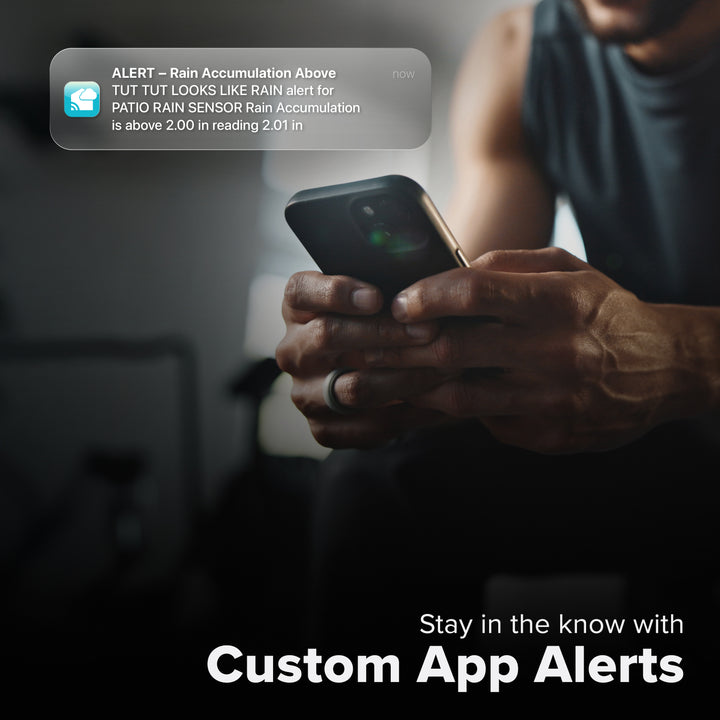 La Crosse Technology Alert and Monitoring system with a male receiving a message on their smartphone of an alert that their rain gauge sensor detected rainfall above their set  parameters of a custom alert for the rain sensor with text that says stay in the know with Custom Alerts