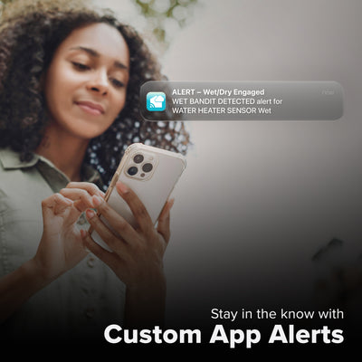 La Crosse Technology Alert and Monitoring system showing a female pushing a stroller looking at her smartphone receiving an alert that her area water leak detection sensor indicates that conditions had changed from dry to wet with text that says stay in the know with Custom Alerts