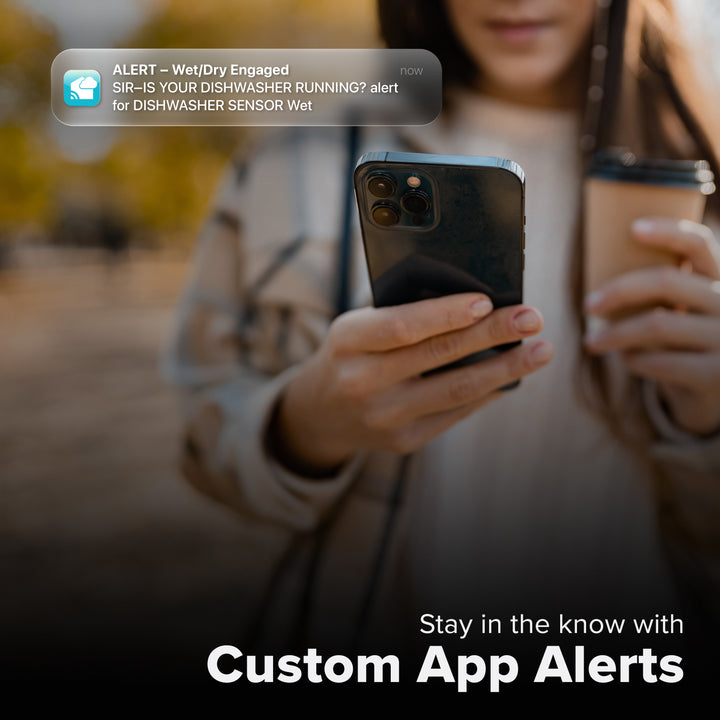 La Crosse Technology Alert and Monitoring system showing a female with a cup of coffee looking at a smartphone receiving an alert for detection of water from her water leak spot detection sensor with text that says stay in the know with Custom Alerts