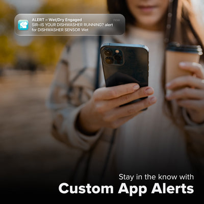 La Crosse Technology Alert and Monitoring system showing a female with a cup of coffee looking at a smartphone receiving an alert for detection of water from her water leak spot detection sensor with text that says stay in the know with Custom Alerts