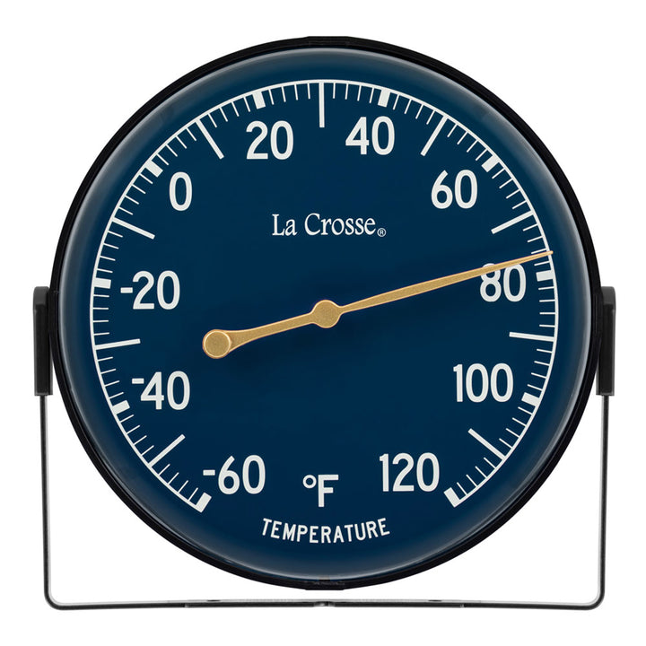 Head-on image of the 104-1512E 5-inch Dial Thermometer with Bracket features a navy blue dial with white temperature readings in a Fahrenheit scale from -60 to 120 degrees, with an antique gold pointer shown with the mounting bracket/stand positioned at the bottom