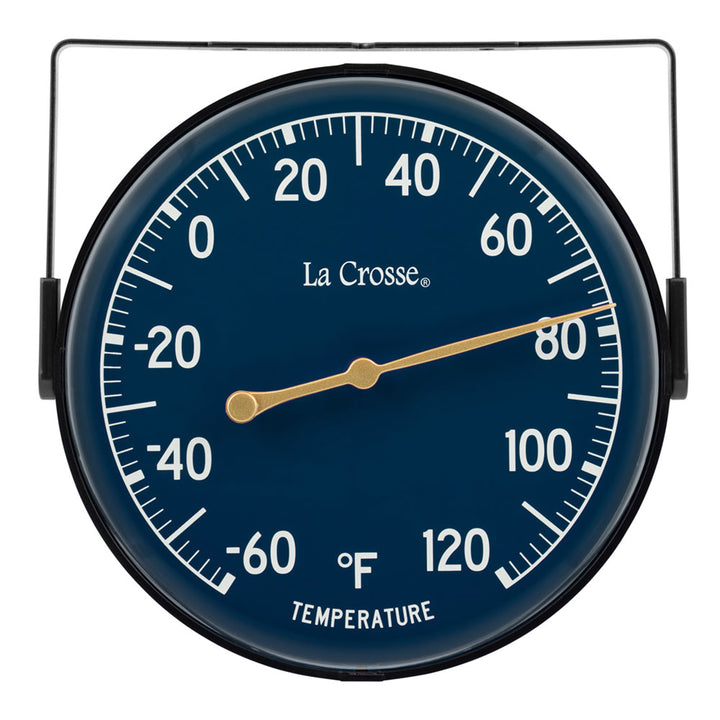 Head-on image of the 104-1512E 5-inch Dial Thermometer with Bracket features a navy blue dial with white temperature readings in a Fahrenheit scale from -60 to 120 degrees, with an antique gold pointer shown with the mounting bracket/stand positioned at the top