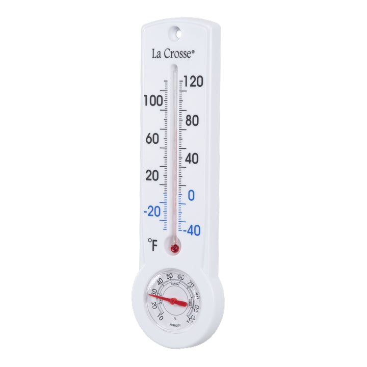 Left-facing image of the 204-109 8.75-inch Thermometer with Hygrometer and Key Hider, constructed in a white case. The mercury-free capillary thermometer has a Fahrenheit temperature scale. Temperature markings below freezing appear in blue text, while those above freezing appear in black text. The Hygrometer dial reads 10-100 percent humidity, with a red pointer.