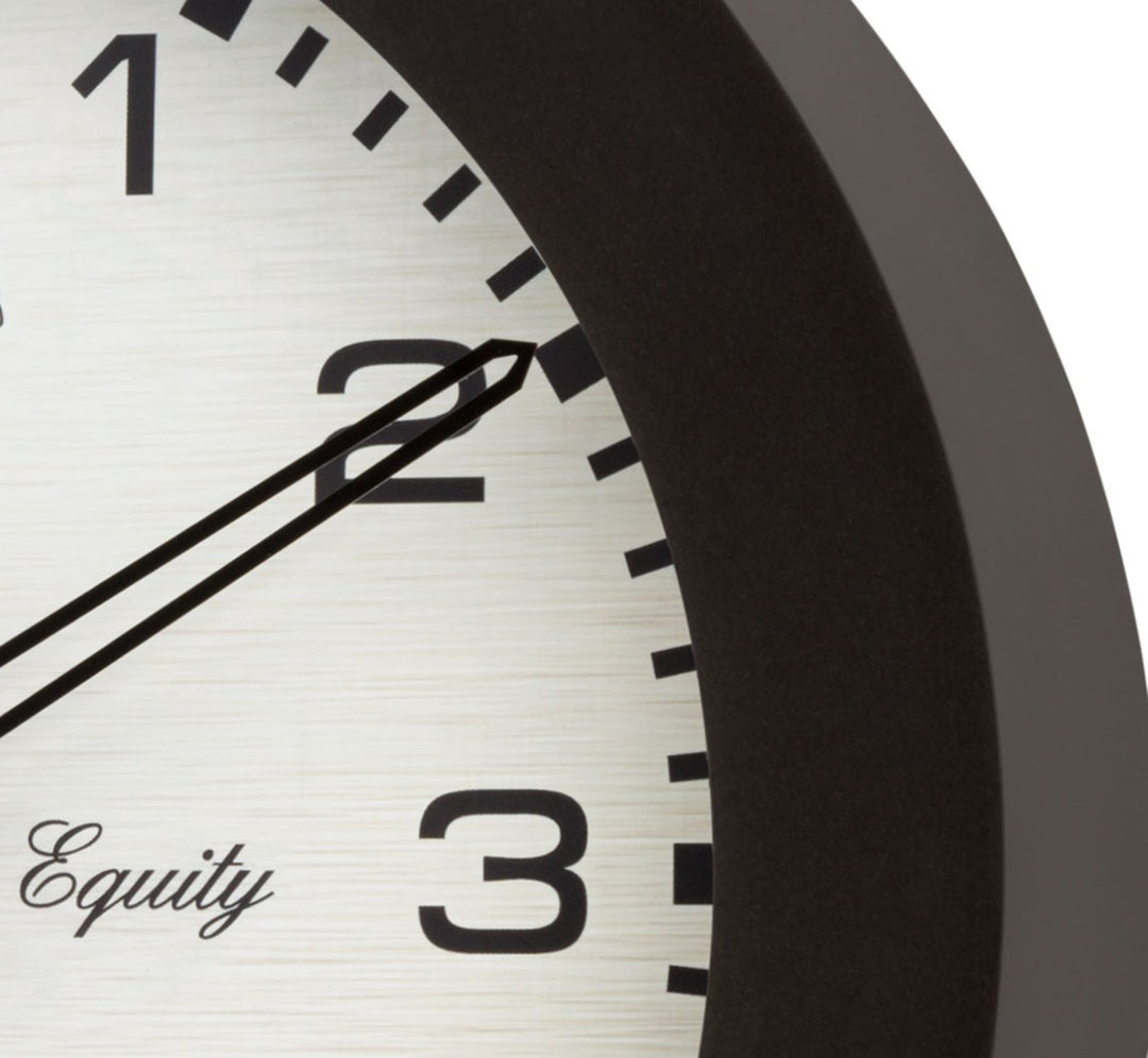 Closeup of the frame and the dial of the 29005 Waylon 10-inch indoor outdoor wall clock showing a dark brown frame and linen design dial