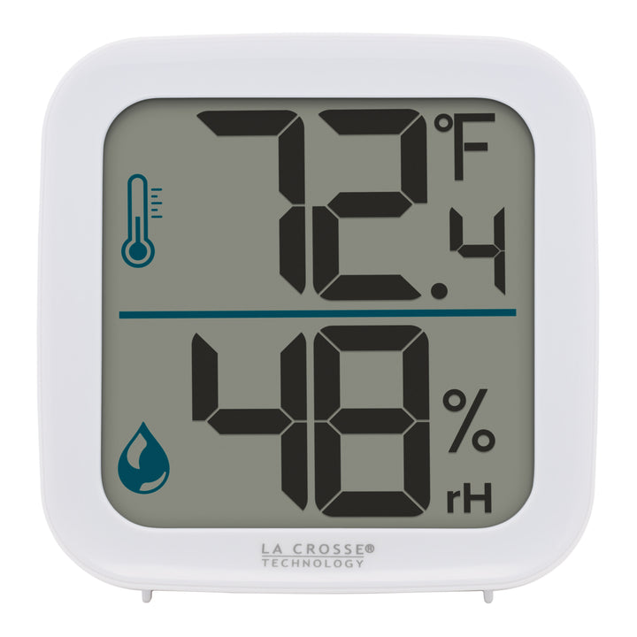 Head-on image of the 302-1407W Thermometer with Temperature and Humidity - White. The thermometer features a white square case and a digital screen with large temperature and humidity readings. There are temperature and humidity icons in blue next to their corresponding readings.