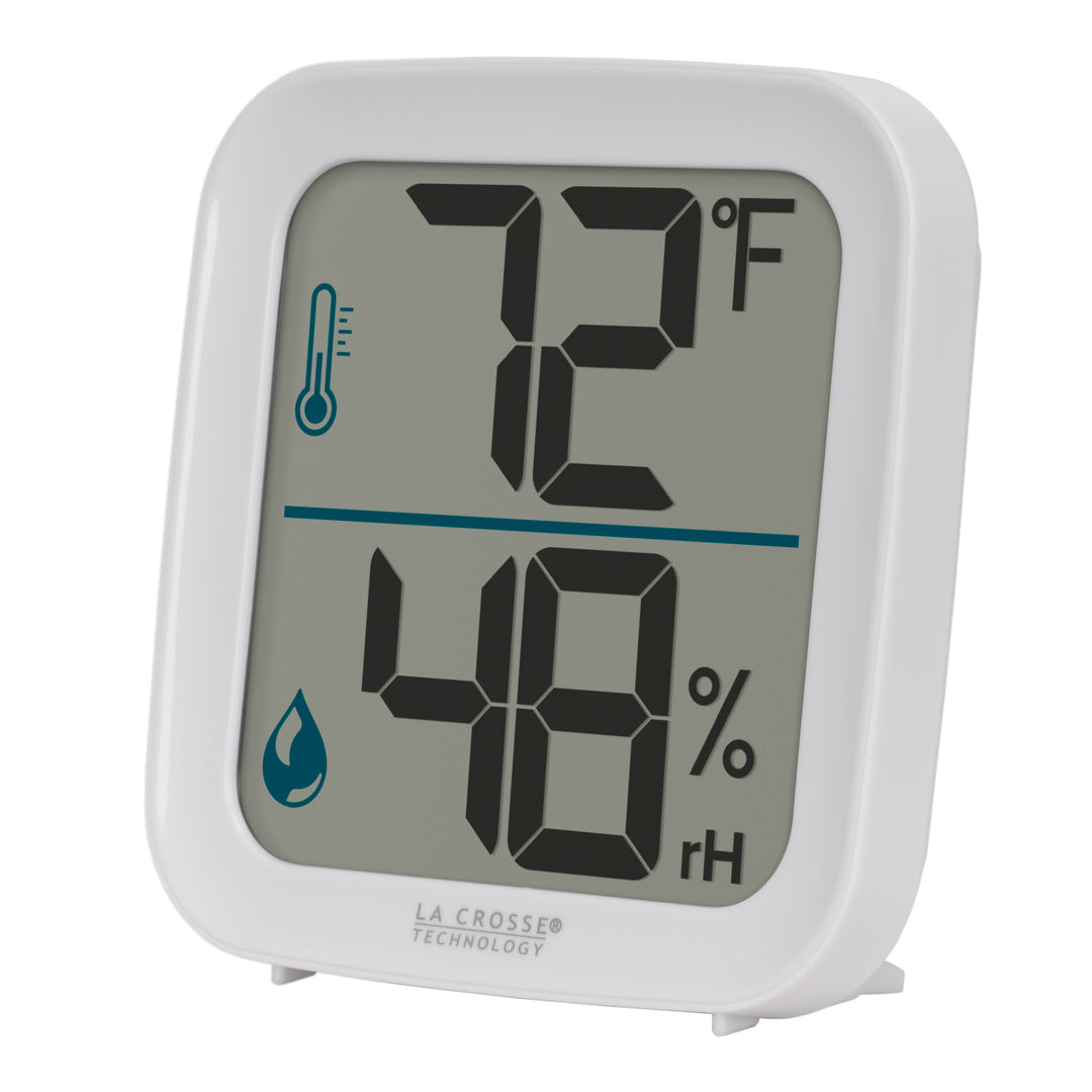 Left-facing image of the 302-1407W Thermometer with Temperature and Humidity - White. The thermometer features a white square case and a digital screen with large temperature and humidity readings. Next to the digits are corresponding temperature and humidity icons in blue.