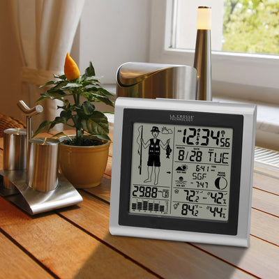 fisherman weather station with forecast on a kitchen table 