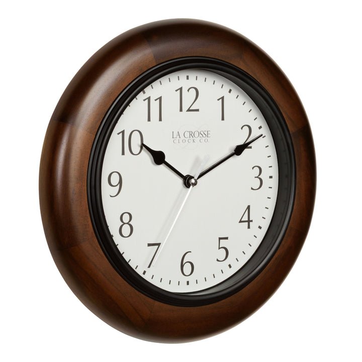 Right-facing 404-2625 Linwood wall clock features a dark stained wood frame surrounding a white dial with simple black numerals and time markings black metal hour and minute hands, and a silver second hand