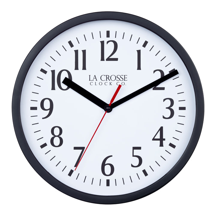 Head-on image of the 404-3020B-4TZ Four Pack 8-inch Basic Wall Clock with City Plaques. The clock features a black frame with a white clock face, black numbers, black hour and minute hands, and a red second hand.