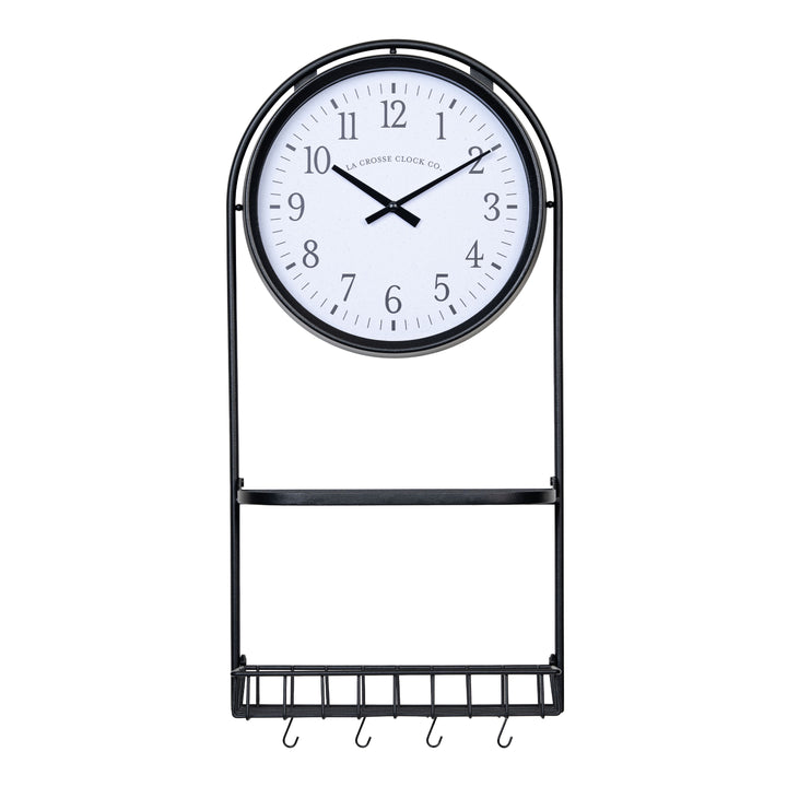 Head-on image of the 404-3022 Depot Wall Clock with Basket and Shelf featuring a Black Metal Frame with a shelf, a basket with four "S" hooks, an archival paper-inspired dial, black numbers, and black metal hour and minute hands.