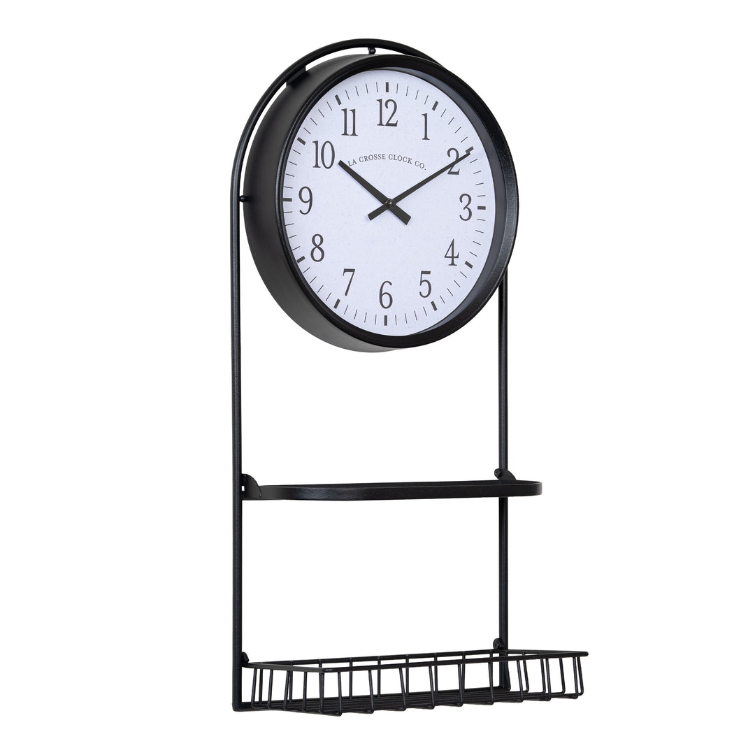 Right-facing image of the 404-3022 Depot Wall Clock with Basket and Shelf featuring a Black Metal Frame with a shelf and a basket, archival paper-inspired dial, black numbers, and black metal hour and minute hands.
