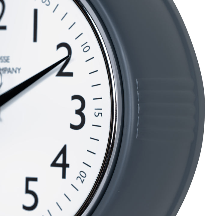 Close-up frame image of the 404-3024DS 9.5-inch Diner Clock – Dark Slate features a retro-style dark slate frame with a white dial, chrome bezel, black numbers and minute markings, black metal hands, and a silver second hand.