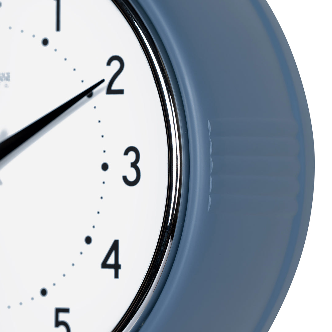 Close-up frame image of the 404-3024IB 9.5-inch Diner Clock – Indigo Blue features a retro-style Indigo Blue frame with a white dial, chrome bezel, black numbers and minute markings, black metal hands, and a silver second hand.