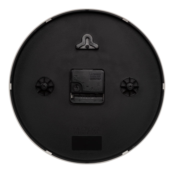 Back image of the 404-3025W 10-inch Basic Decor Wall Clock showing the hanging hole for mounting, easy set time wheel, the Quartz movement with battery compartment