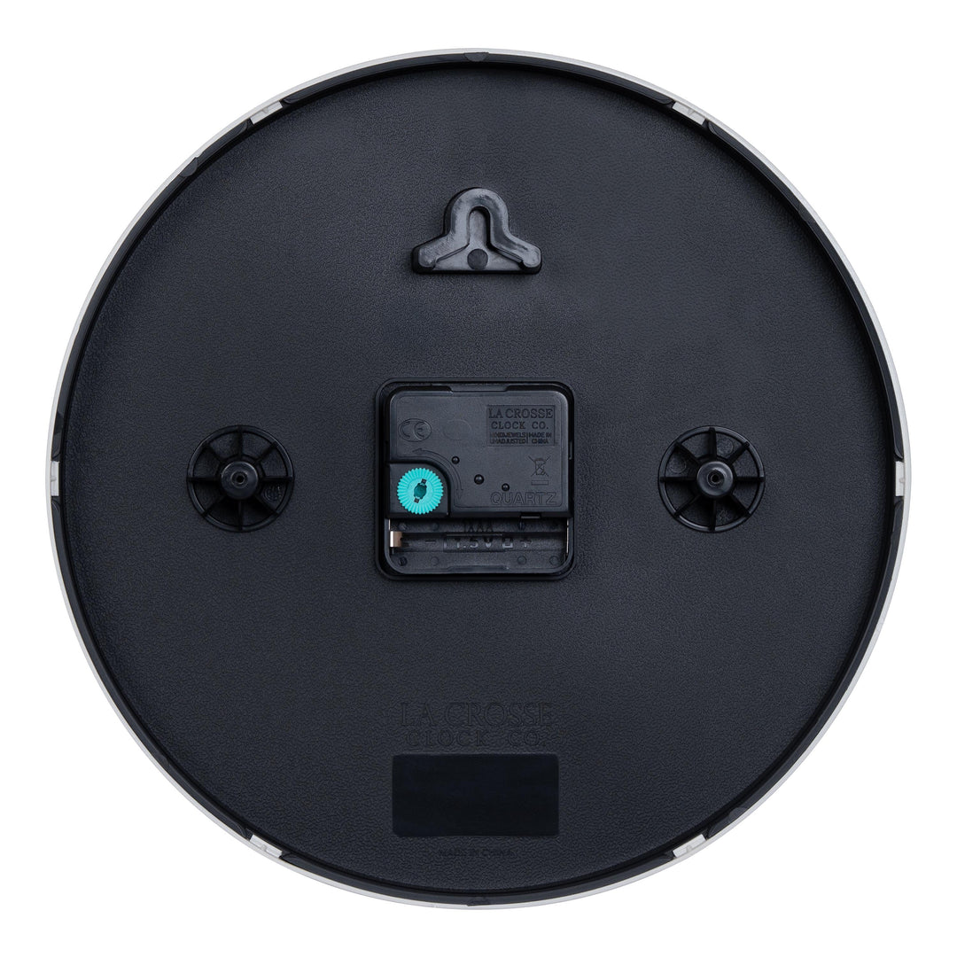 Back image of the 404-3025Y 10-inch Basic Decor Wall Clock showing the hanging hole for mounting, easy set time wheel, the Quartz movement with battery compartment