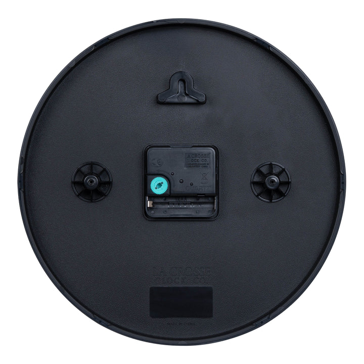 Back image of the 404-3025 10-inch Basic Decor Wall Clock showing the hanging hole for mounting, easy set teal time wheel, the La Crosse Clock Quartz movement with battery compartment