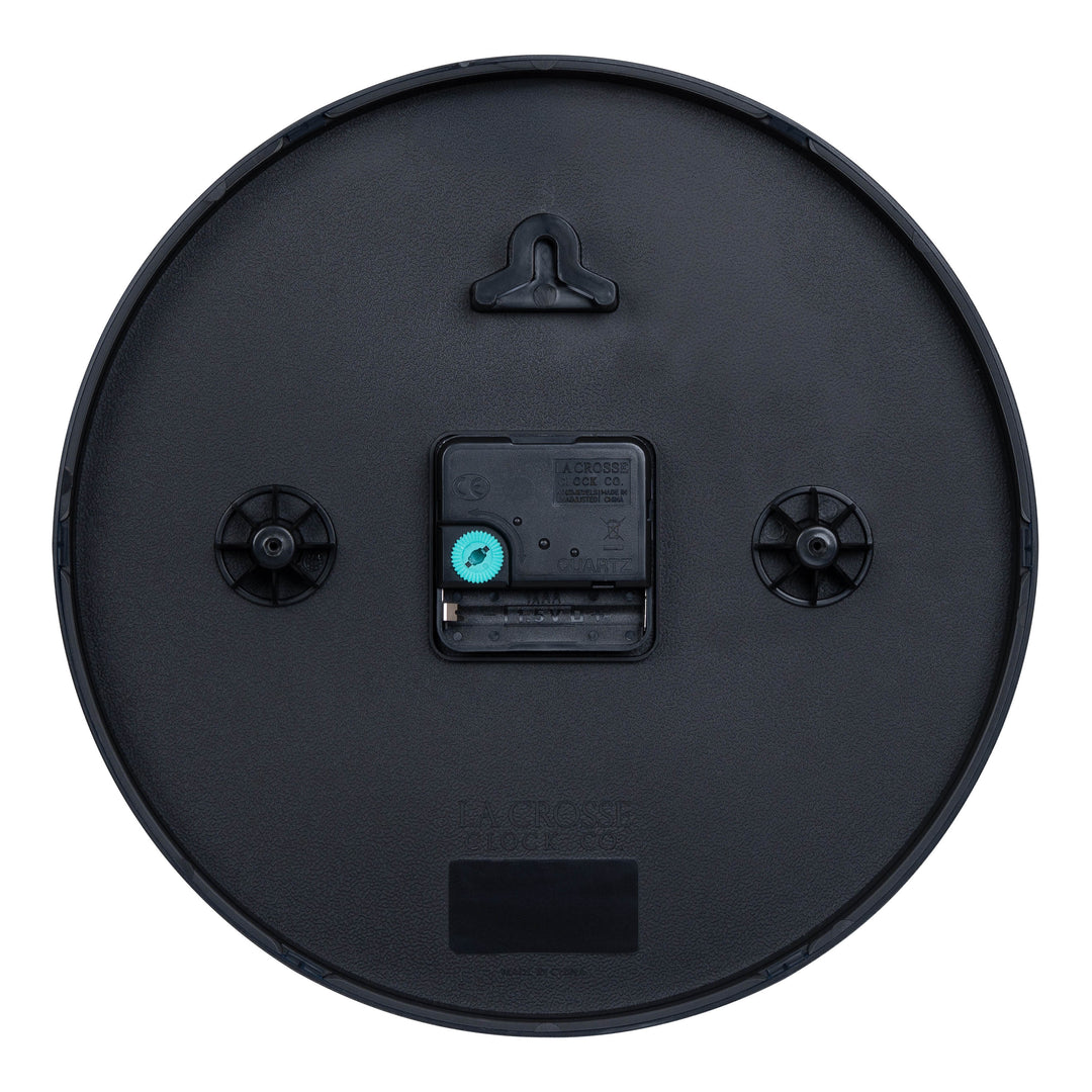Back image of the 404-3025 10-inch Basic Decor Wall Clock showing the hanging hole for mounting, easy set teal time wheel, the La Crosse Clock Quartz movement with battery compartment