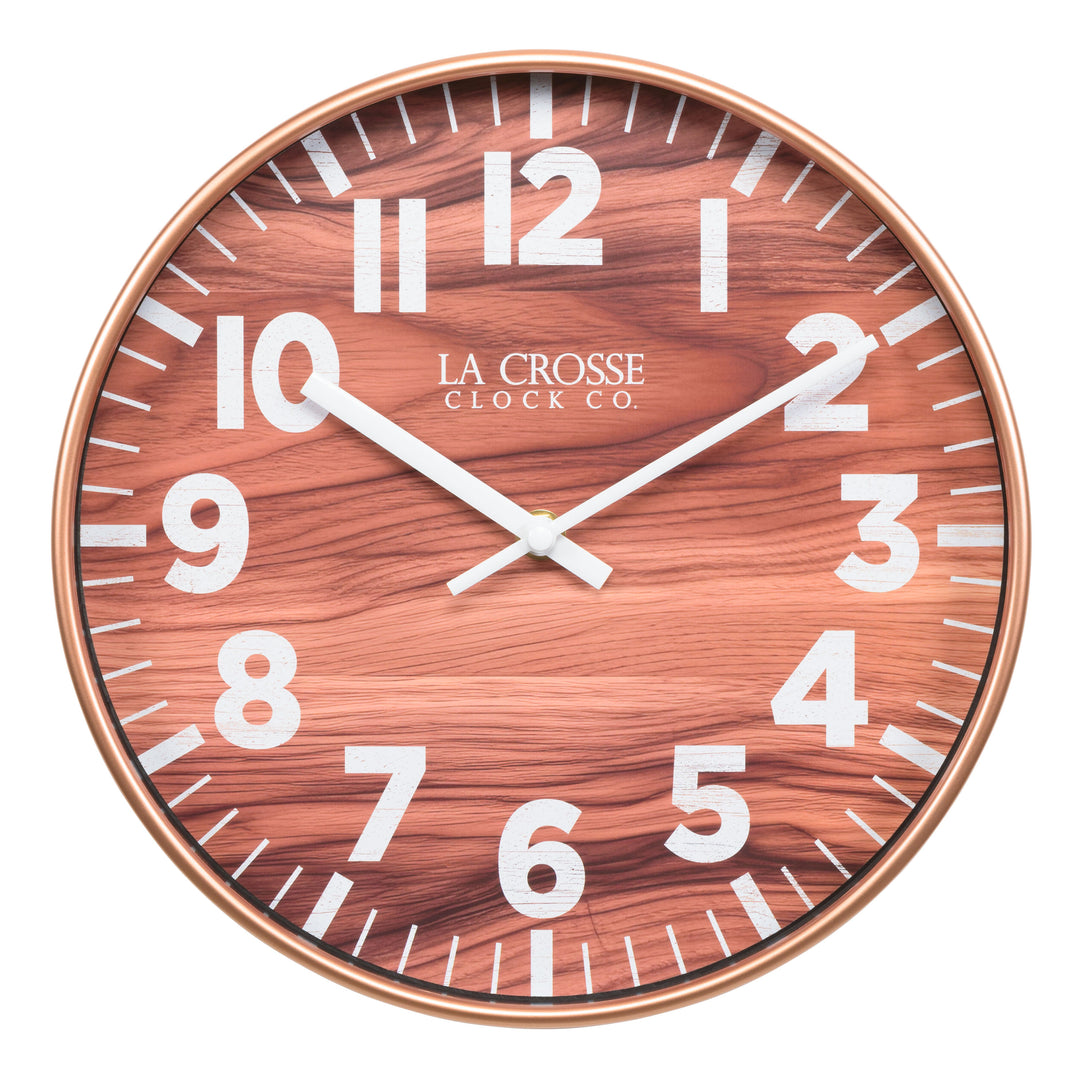Head-on image of the 10.8-inch Atwood Wall Clock featuring a copper finish frame, a wood design dial, white numbers, and white metal hour and minute hands.