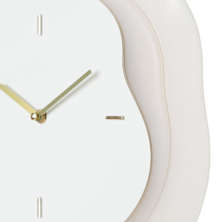 Close-up frame image of the 404-3039T 15.2-inch Drift Wall Clock – Tan featuring the open face multi-layered design with drifting contours, metal hands, and raised number markings in a brass finish.
