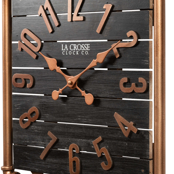 Close-up frame image of the 404-3412D 16-inch Foundry Metal &amp; Wood Wall Clock - Dark. The clock features a square metal pipe frame, stained wood slats, and metal pewter finish accents.