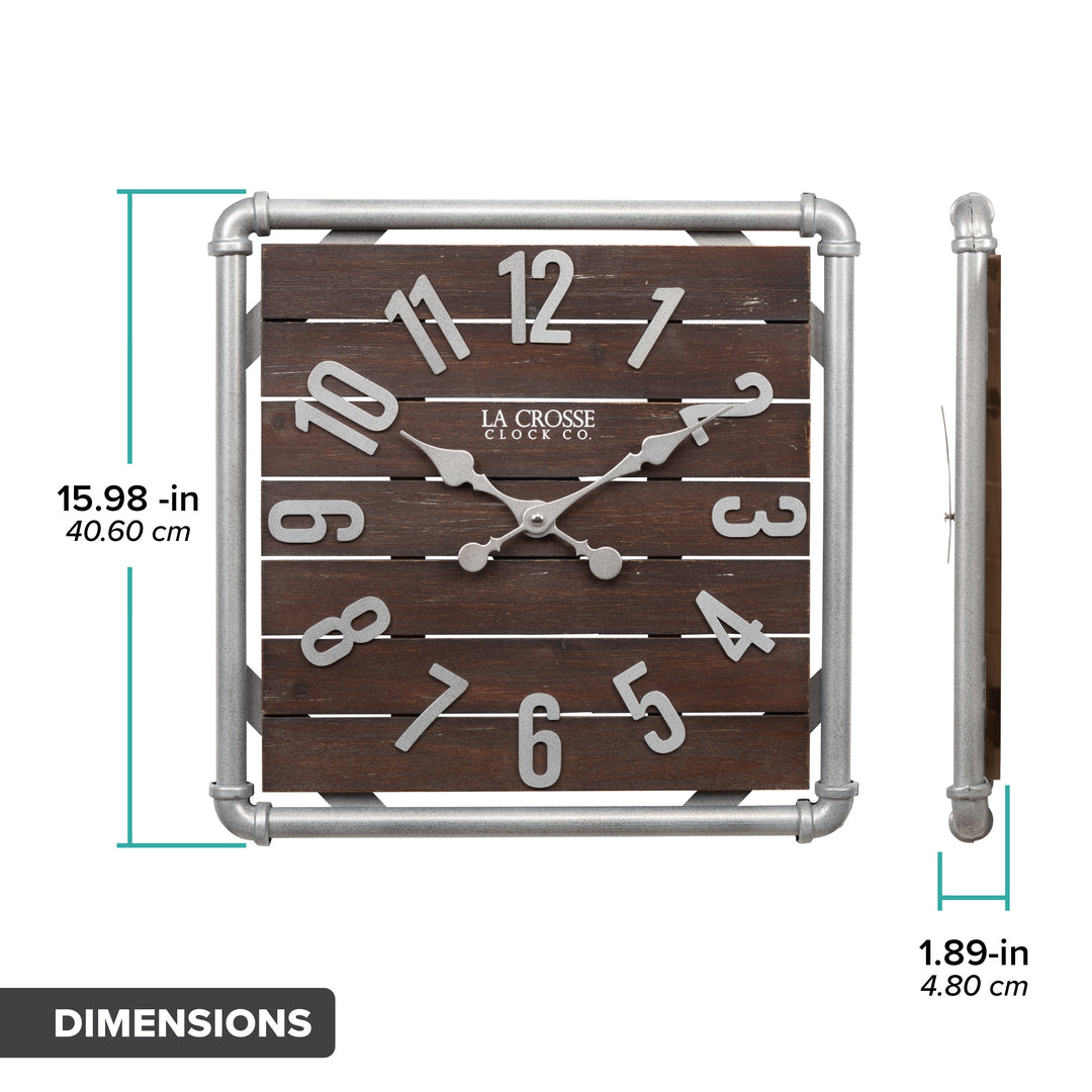 Dimension image in inches and centimeters of the 404-3412L 16-inch Foundry Metal &amp; Wood Wall Clock - Light. The clock features a square metal pipe frame, stained wood slats, and metal pewter finish accents. The clock is 15.98 inches square and 1.89 inches deep.