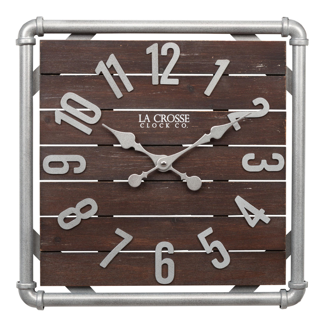 Head-on image of the 404-3412L 16-inch Foundry Metal &amp; Wood Wall Clock - Light. The clock features a square metal pipe frame in a weathered pewter finish, a truffle-brown-stained wood slat clock face with pewter-finished metal numbers and hands.