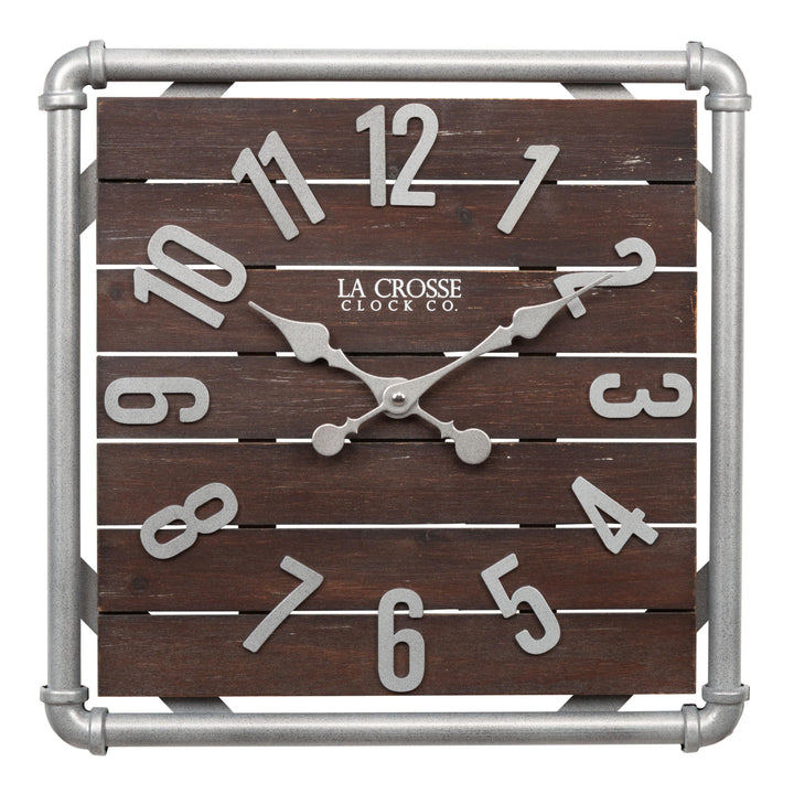 Head-on image of the 404-3412L 16-inch Foundry Metal &amp; Wood Wall Clock - Light. The clock features a square metal pipe frame in a weathered pewter finish, a truffle-brown-stained wood slat clock face with pewter-finished metal numbers and hands.