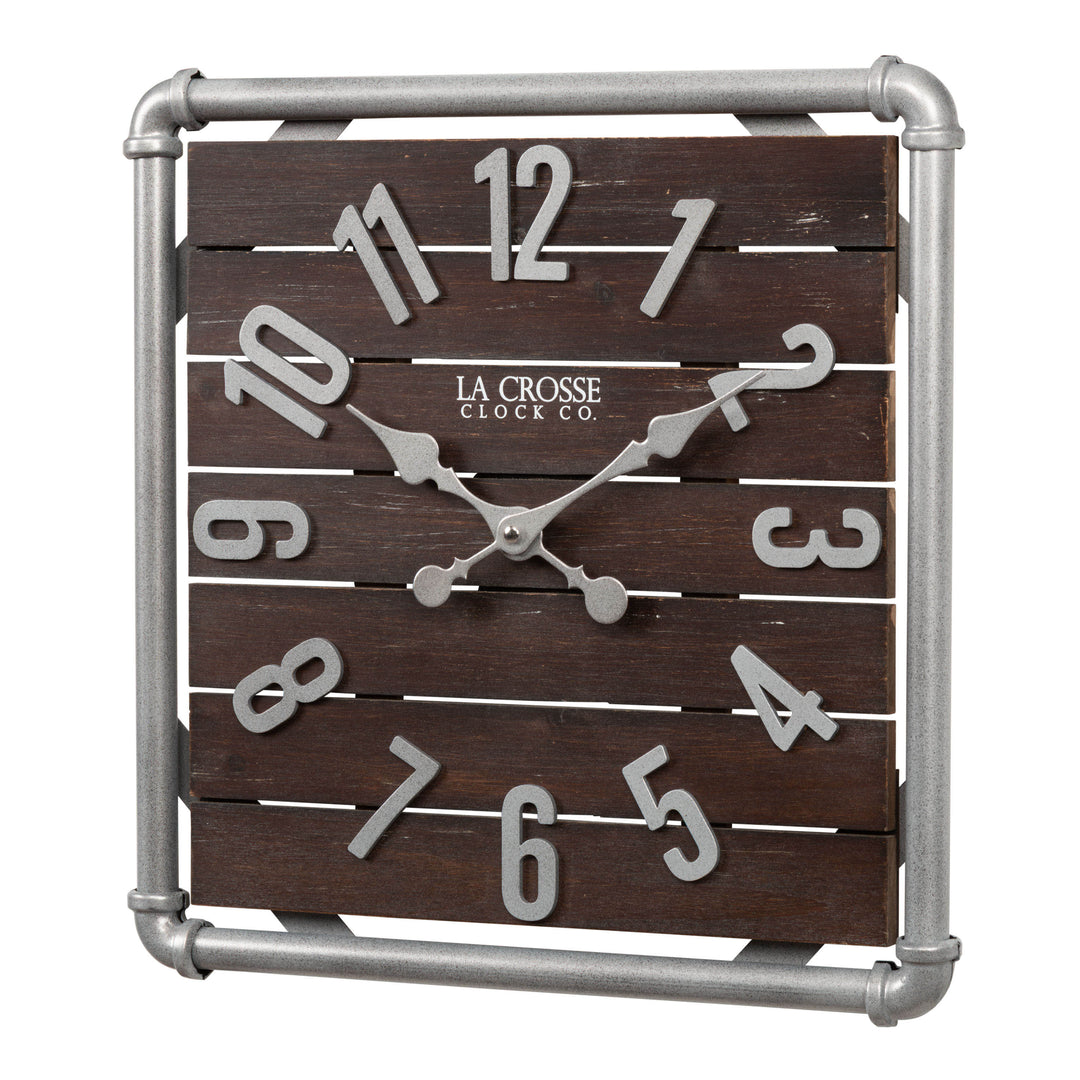 Left-facing image of the 404-3412L 16-inch Foundry Metal &amp; Wood Wall Clock - Light. The clock features a square metal pipe frame in a weathered pewter finish, a truffle-brown-stained wood slat clock face with pewter-finished metal numbers and hands.