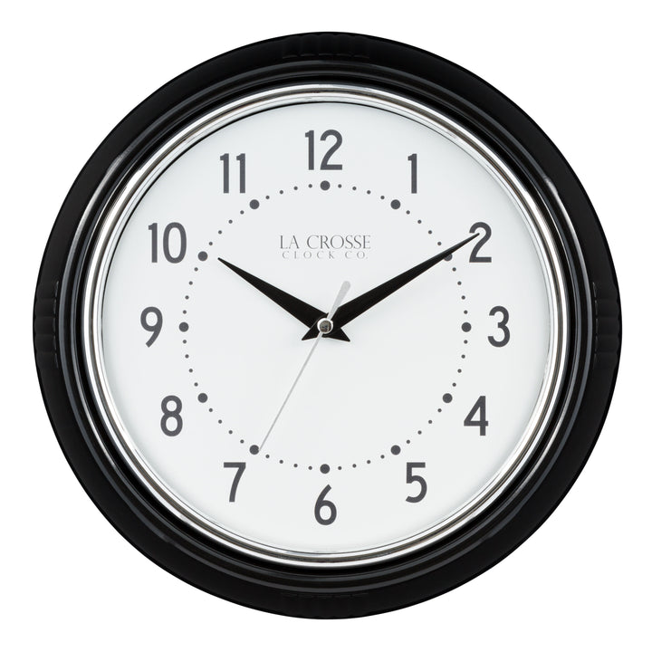 Black and white head-on image of the 404-3624B 9.5-inch Diner Wall Clock featuring a black frame with chrome bezel accent, an off-white dial with black numbers and hour dots, a silver second hand, and black hour and minute hands.