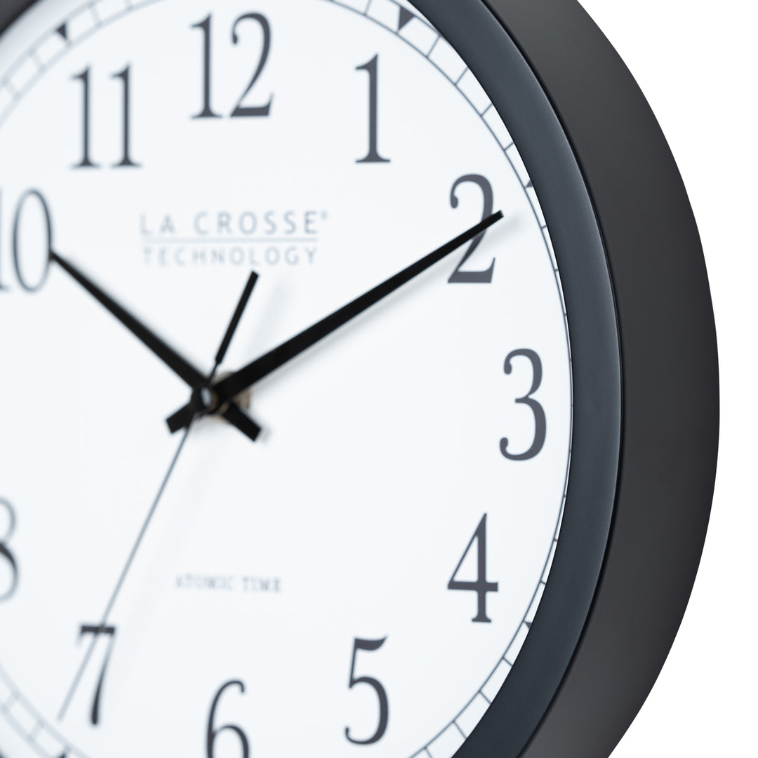Close-up frame image of the 404-3826 10-inch Atomic Analog Wall Clock showing the flush-mount detail of the frame. The clock features a black flush-mount frame, stylized black numerals, and black metal hands.