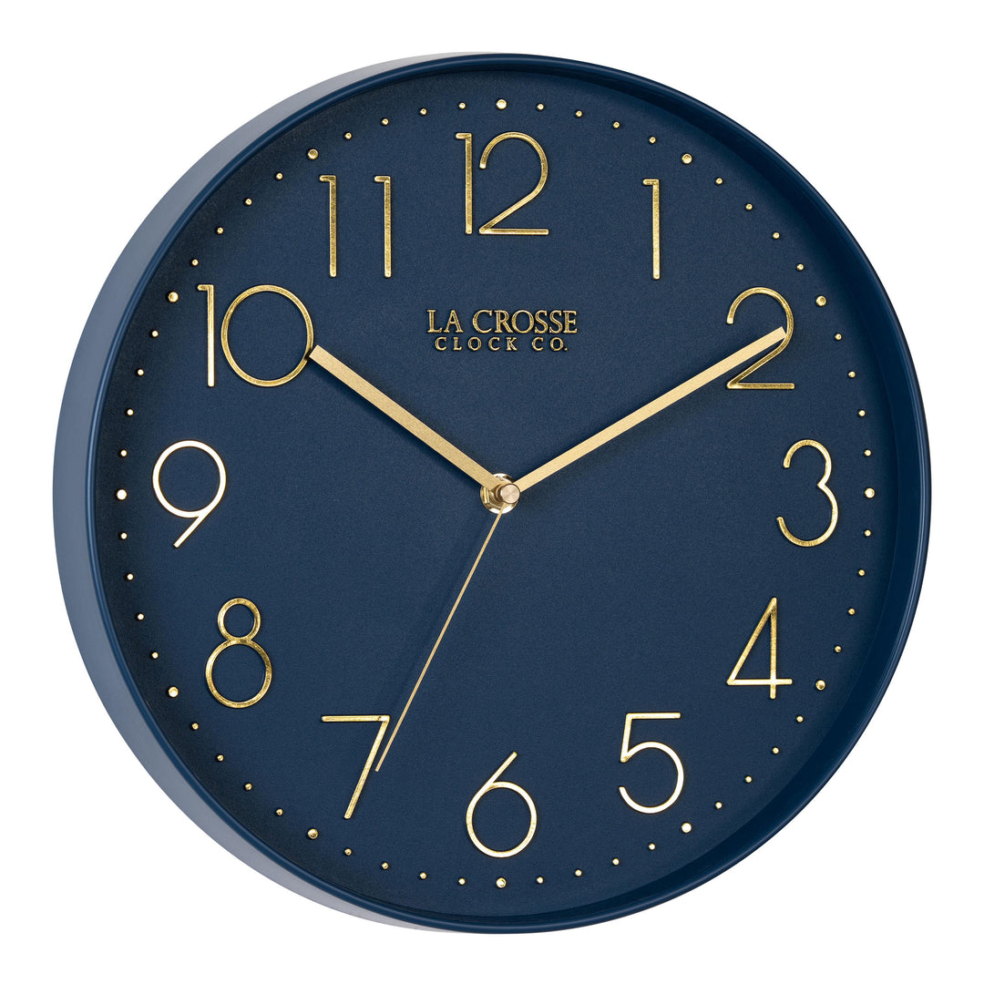 Right-facing image highlighting the buttons of the 404-3831NB 12-inch Paxton Wall Clock - Navy Blue, with Silent Sweep, featuring a flush-mount navy blue frame, a matching color dial, brass raised numbers, and brass-finished hour, minute, and second hands.