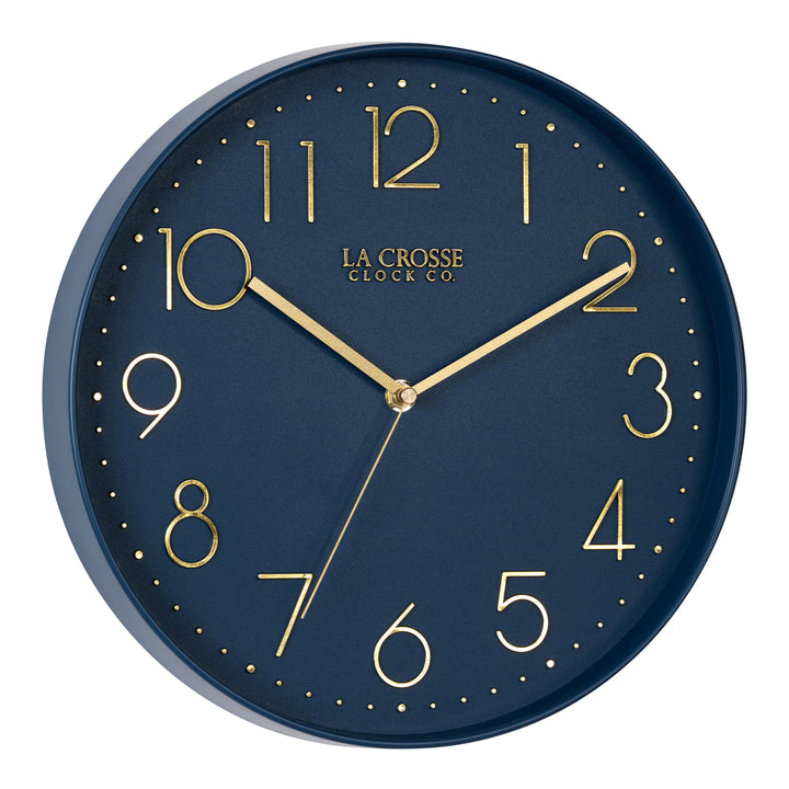 Right-facing image highlighting the buttons of the 404-3831NB 12-inch Paxton Wall Clock - Navy Blue, with Silent Sweep, featuring a flush-mount navy blue frame, a matching color dial, brass raised numbers, and brass-finished hour, minute, and second hands.