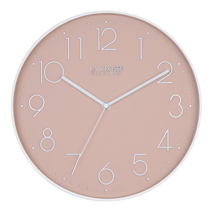 Head-on image of the 404-3831P 12-inch Paxton Wall Clock - Peach, with Silent Sweep, featuring a flush-mount peach frame, a matching color dial, white raised numbers, and white metal hour, minute, and second hands.