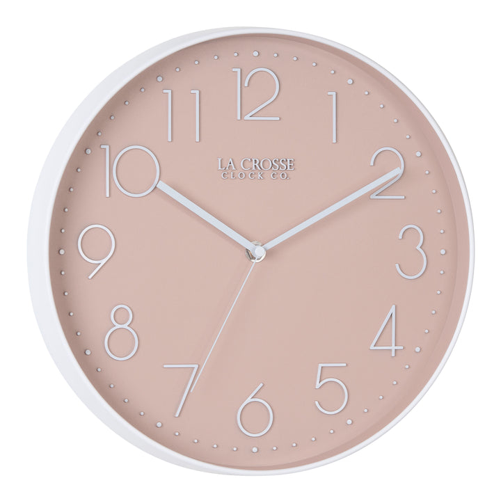 Right-facing image highlighting the buttons of the 404-3831P 12-inch Paxton Wall Clock - Peach, with Silent Sweep, featuring a flush-mount peach frame, a matching color dial, white raised numbers, and white metal hour, minute, and second hands.