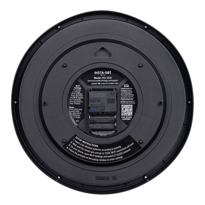 Back view showing the battery compartment with instructions and a QR code of the 404-3836 Insta-Set Wi-Fi Analog Wall Clock in black plastic and white text