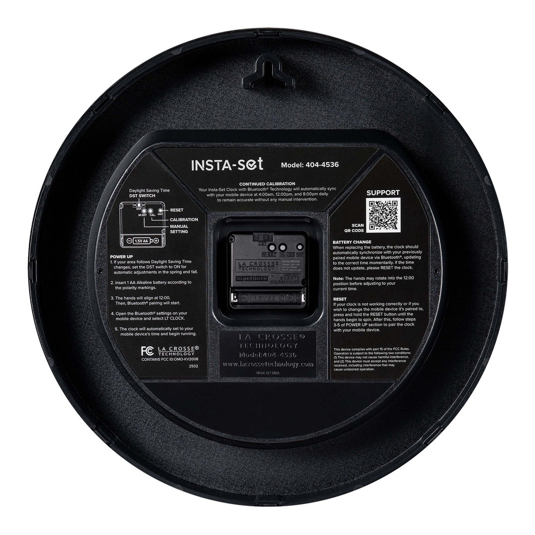 Back image of the 404-4536 14.2-inch Insta-Set Wall Clock with Bluetooth® Technology showing the battery compartment, the quartz movement, the hanging hole, and instructions for operation of the Insta-Set technology.