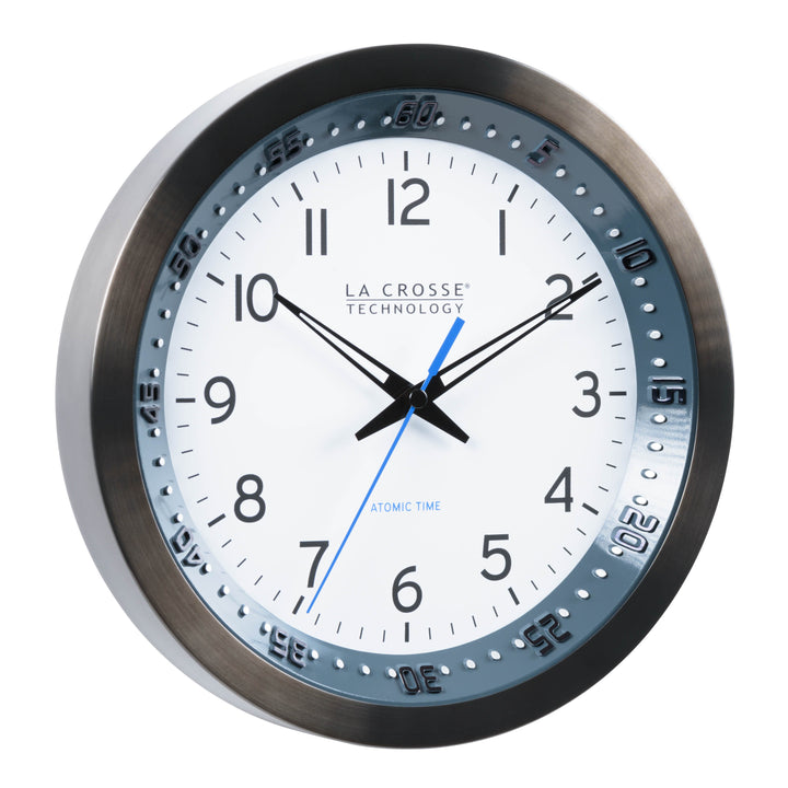 Right-facing image of the 10-inch 404-54667 Atomic Metal Wall Clock with Blue Chapter Ring. The clock features a black stainless steel frame with a blue chapter ring and raised seconds indicators, surrounding a white dial with black numbers, metal hands, and a blue accent second hand.