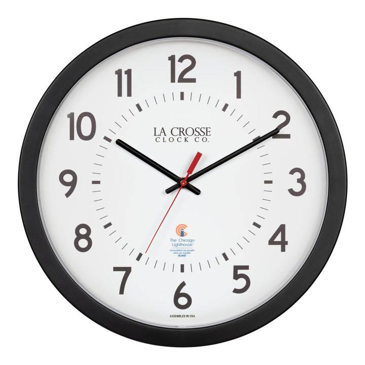 Head-on image of the 404-5537 14.5-inch Wall Clock with black bold numbers, black hour and minute hands, and a red second hand. Two logos apear on the clock, 
La Crosse Clock Co. and Chicago Lighthouse industries - a partner that employs the blind to bring this classic wall clock to consumers.
