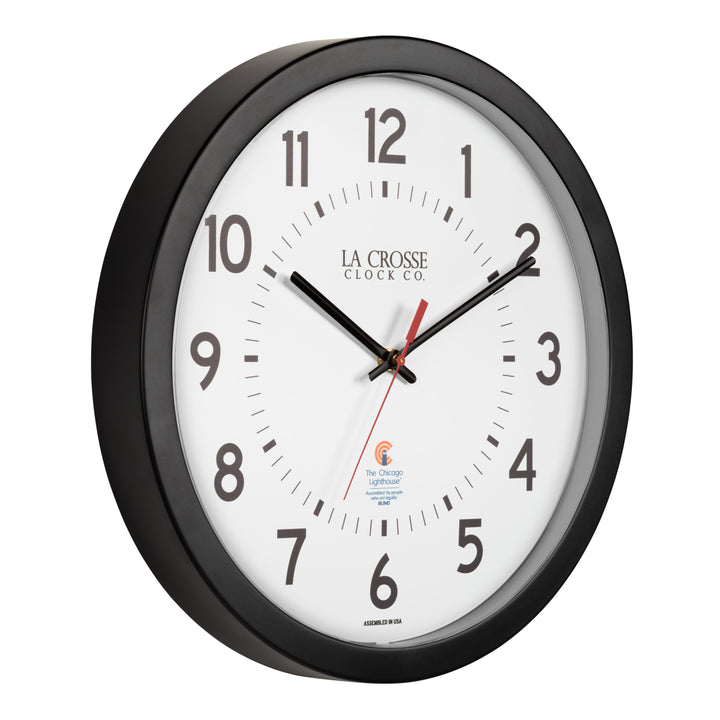 Right-facing image of the 404-5537 14.5-inch Wall Clock with black bold numbers, black hour and minute hands, and a red second hand. Two logos apear on the clock, 
La Crosse Clock Co. and Chicago Lighthouse industries - a partner that employs the blind to bring this classic wall clock to consumers.