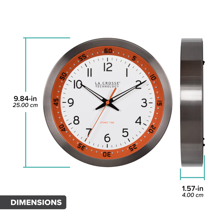 Orthographic image of the 404-87696 10-inch Atomic Metal Wall Clock - Chapter Ring: Orange. The clock features a white dial, an orange chapter ring with seconds indicator, black hands, an orange second hand, and a stainless steel flush-mount frame. The image shows the clock dimensions in inches and centimeters.
