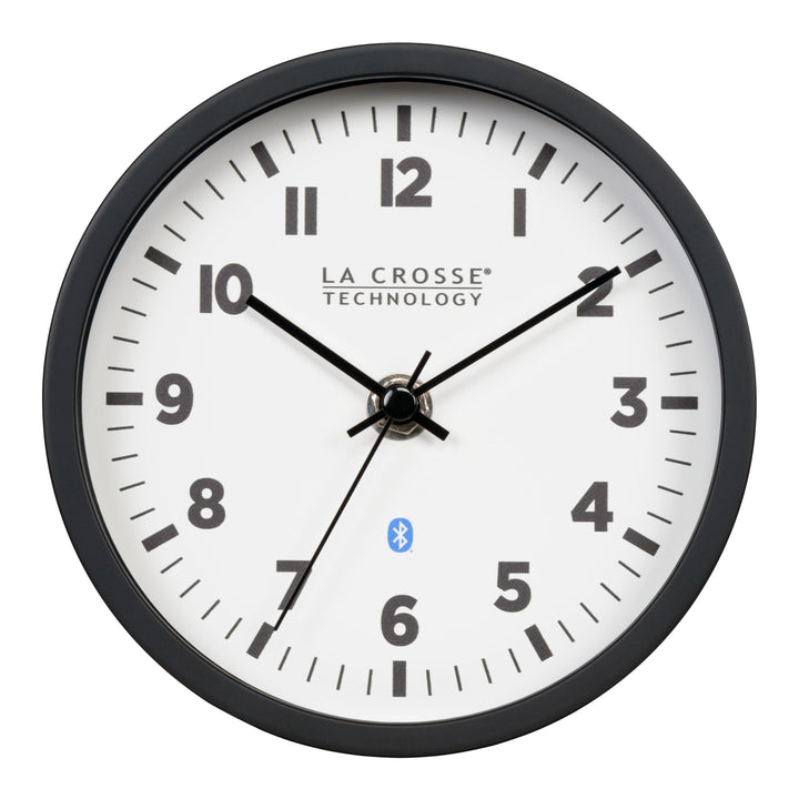 Head-on image of the 437-3816 Insta-Set Table/Wall Clock with Bluetooth® Technology featuring a white dial with bold black numerals, black metal hands, and a black frame with the base removed for wall hanging placement.