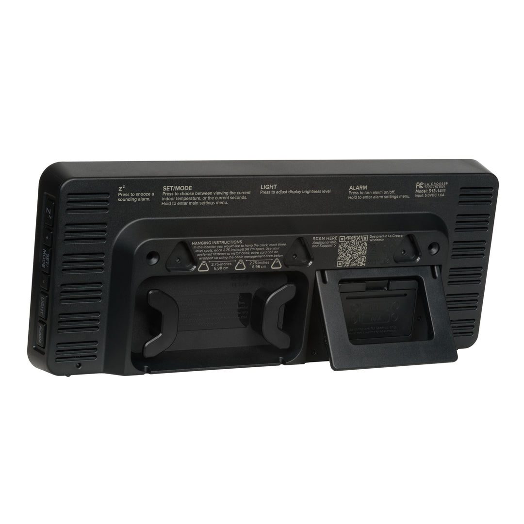 Angled back image of the 513-1411R Digital LED Wall Clock with Indoor Temperature featuring the pull-out kickstand, cable management system, hanging holes, and the battery compartment.