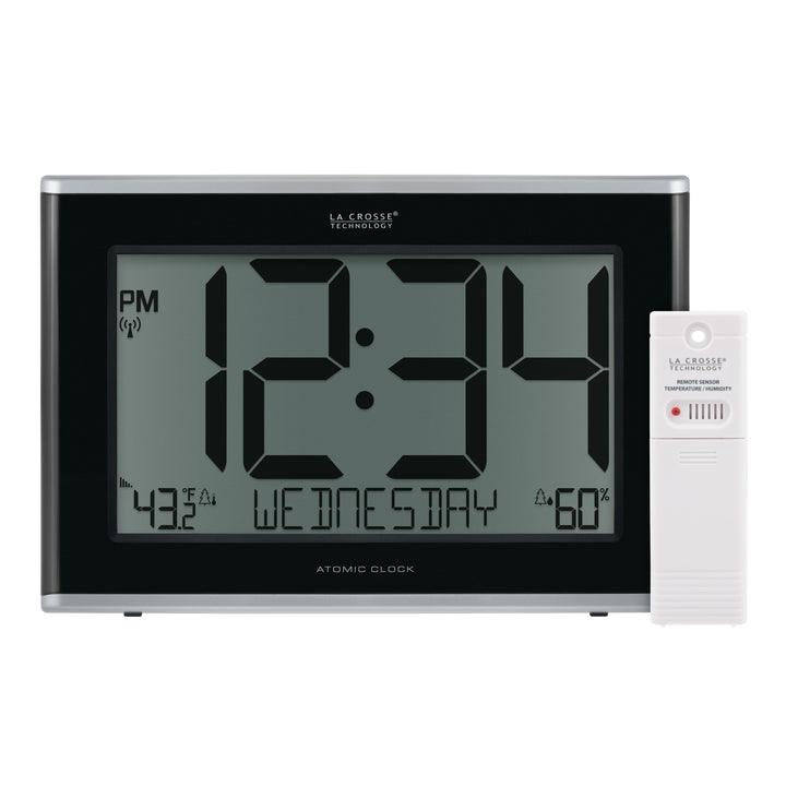 Group image of the 513-36908 Executive Atomic Digital Wall Clock with Temperature and Humidity features a black frame, a large LCD screen displaying 12:34 pm, Wednesday, indoor temperature, humidity, and signal icons, shown with the included white remote temperature and humidity sensor.