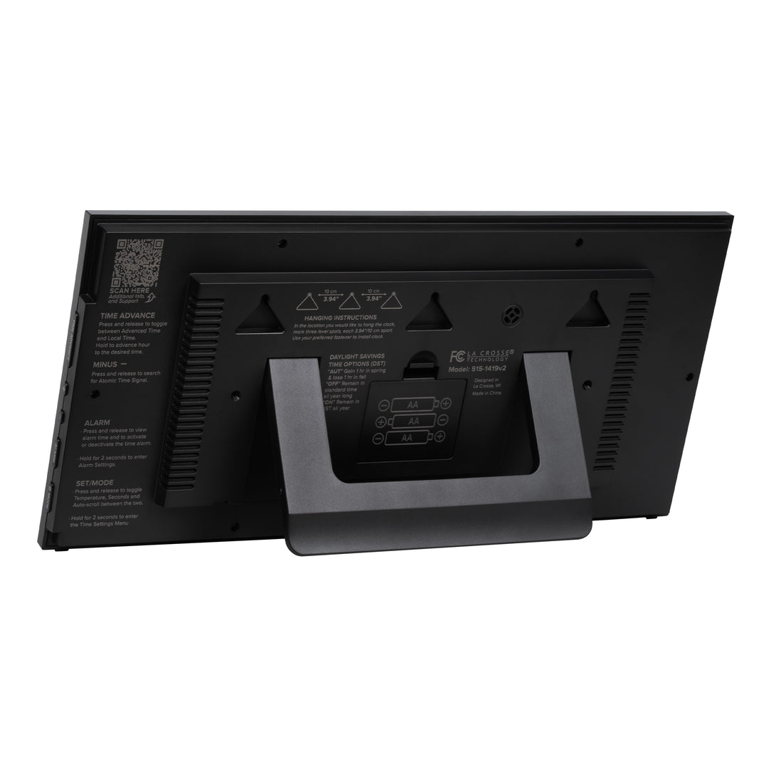 Back image of the 515-1419v2 Atomic Digital Wall Clock with Time Advance showing the built-in kickstand, the three hanging holes, and the battery compartment with basic instructions screenprinted on the back of the clock.