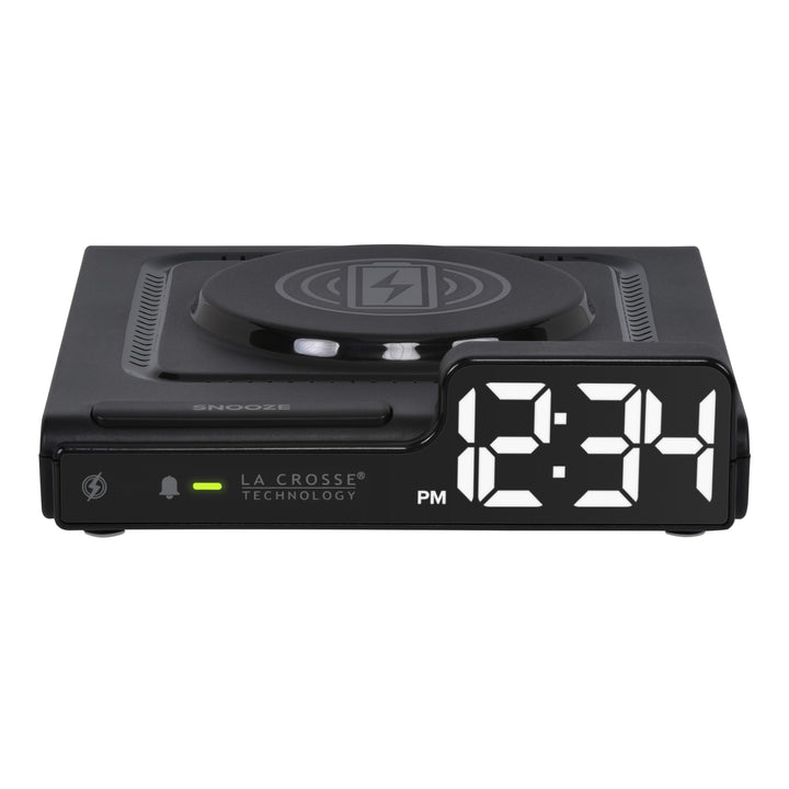 Head-on image of the 617-143 Amp Mini 15W Wireless Charging LED Alarm Clock. The alarm clock features a wireless charging pad, easy access buttons, an alarm with snooze, white time digits, and LED status light.