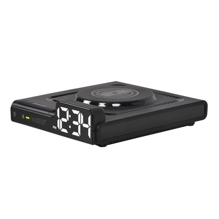 Left-facing image of the 617-143 Amp Mini 15W Wireless Charging LED Alarm Clock. The alarm clock features a wireless charging pad, easy access buttons, an alarm with snooze, white time digits, and LED status light.