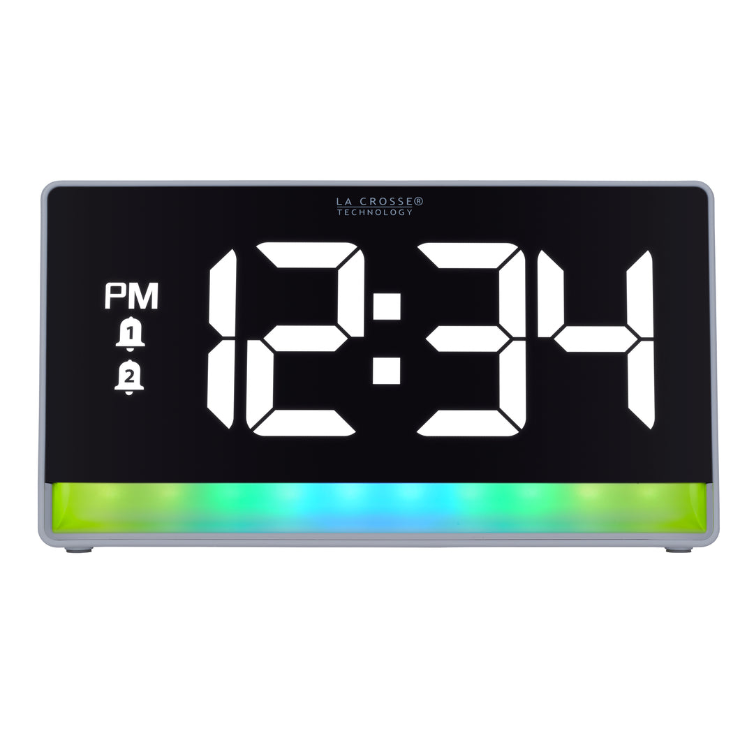 Hed-on image of the 617-149 Digital Alarm Clock with Color Changing Glow Light, the alarm clock features a white case, a color-changing bar at the base shown in blues and greens, and a black display with white digits.